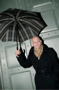 Shot of David, wearing Burberry Trench Coat with Burberry Trench Coat, holding Burberry Check Umbrella